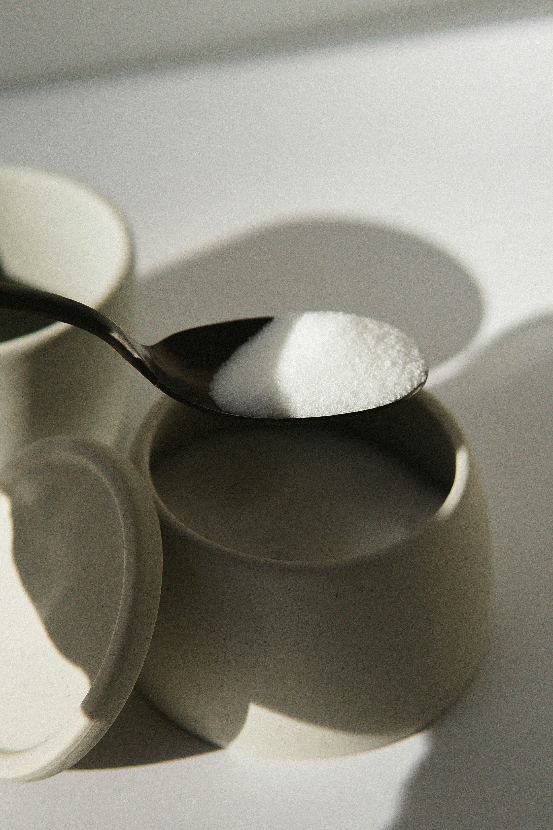 stainless steel spoon in white ceramic mug